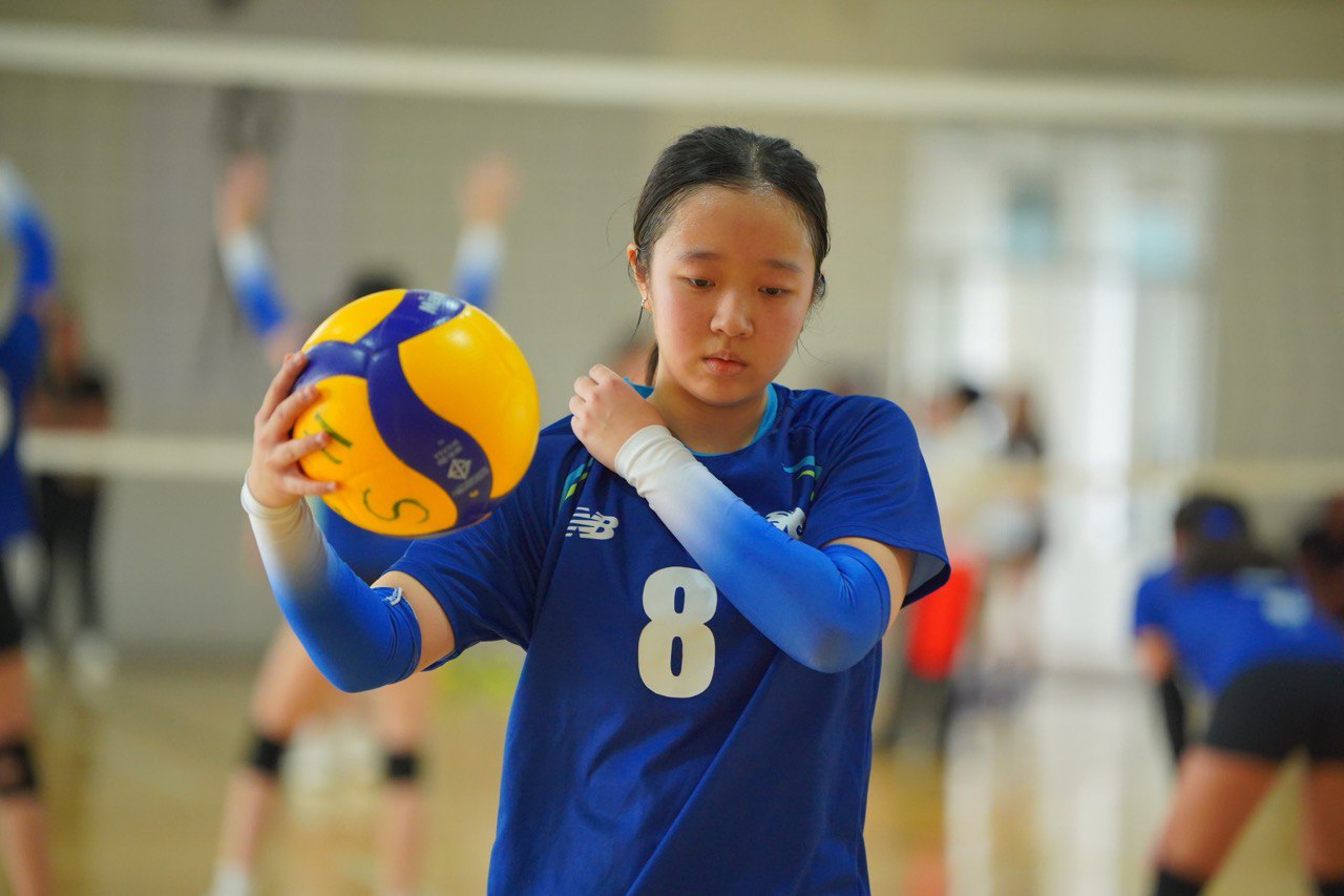 Gabrielle playing volleyball